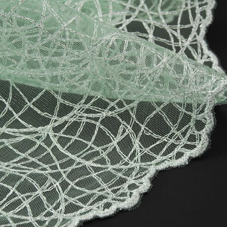 Krajka geometrický vzor vlnek pistáciová