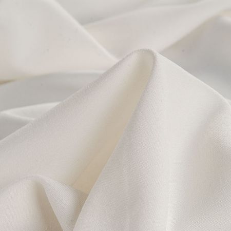 Kostýmová pružná látka imitace lnu smetanová