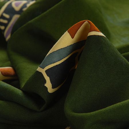 Viskozová šatová látka ento vzor zelená