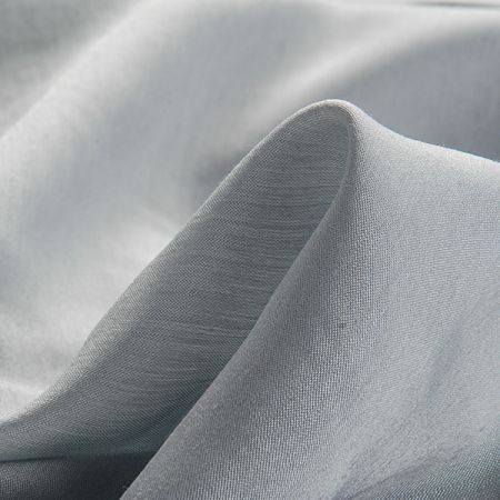 Lamé šatová látka stříbrnošedá světlá