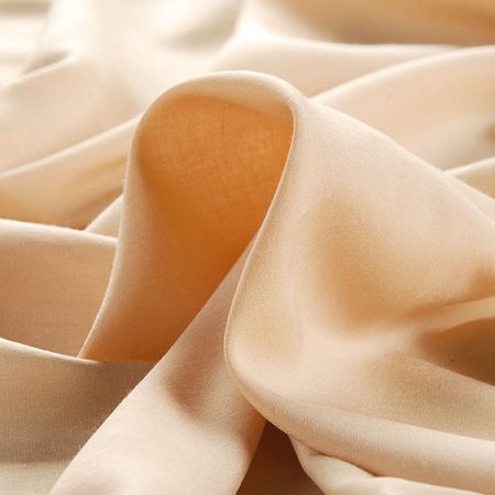 Viskozová šatová látka jemná tělové barvy