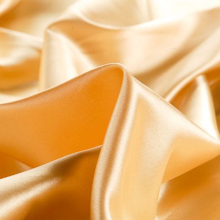 Satén pružný matný pastel zlatožlutý