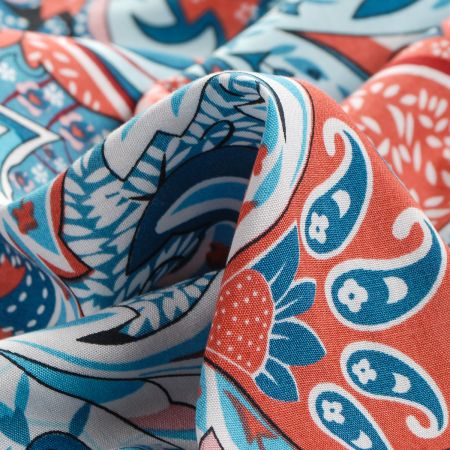 Viskozová šatová látka tisk paisley vzor cihlovomodrý