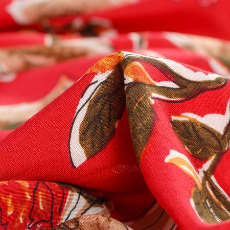 Viskozová šatová látka hnědé květy v malinově červeném