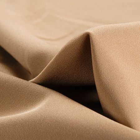 Kostýmová látka barvy tmavší camel