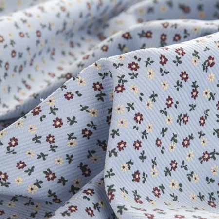 Manšestr pružný drobný kytičkový vzor sv.modrý