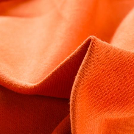 Úplet bavlněný středně silný pastel oranžovoskořicová