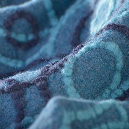 Látka efektní vlněný úplet motiv kruhů tyrkys