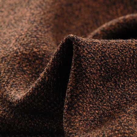 Kostýmová látka hrubší struktury tm.hnědočerná